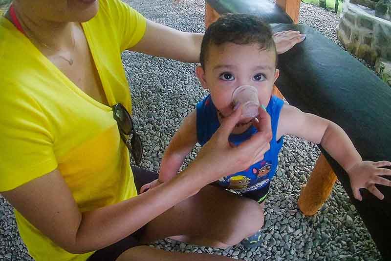 Small boy tasting chocolate on Jungle Rally Tour in Punta Cana